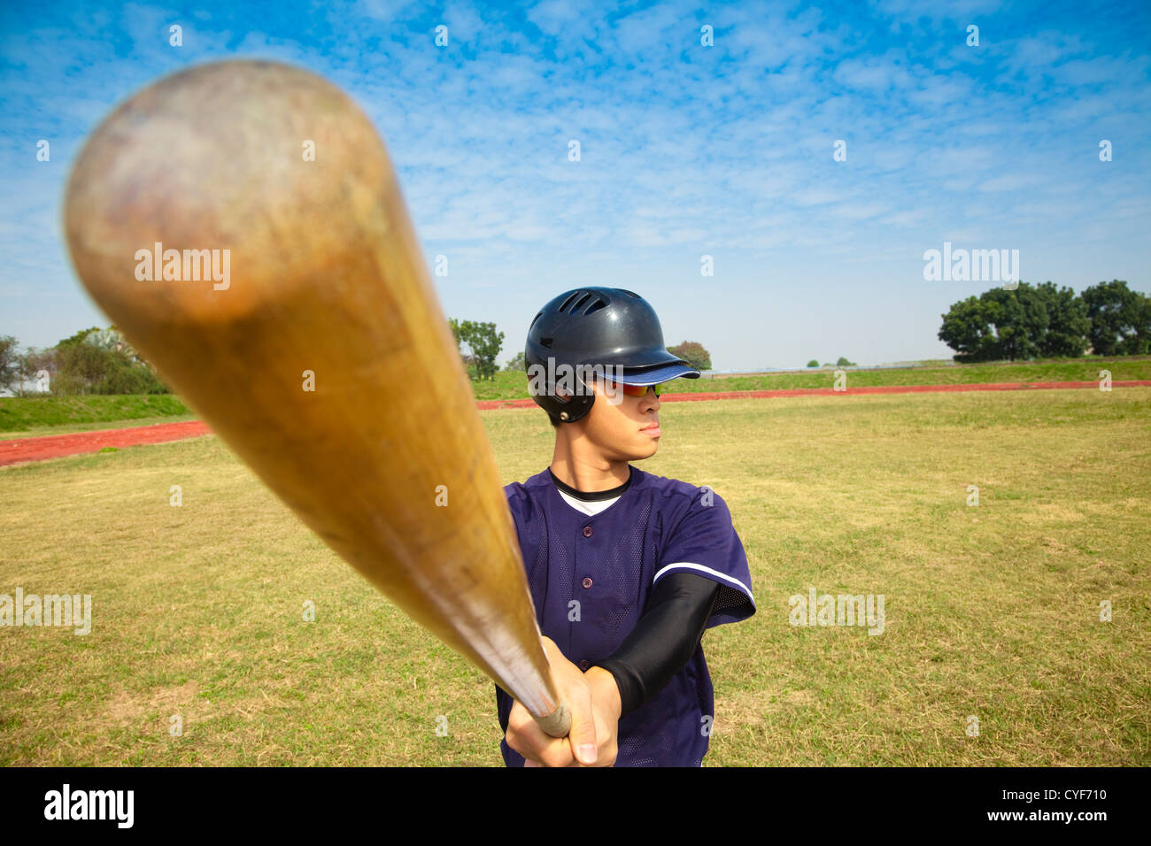 baseball player holding baseball bat Stock Photo