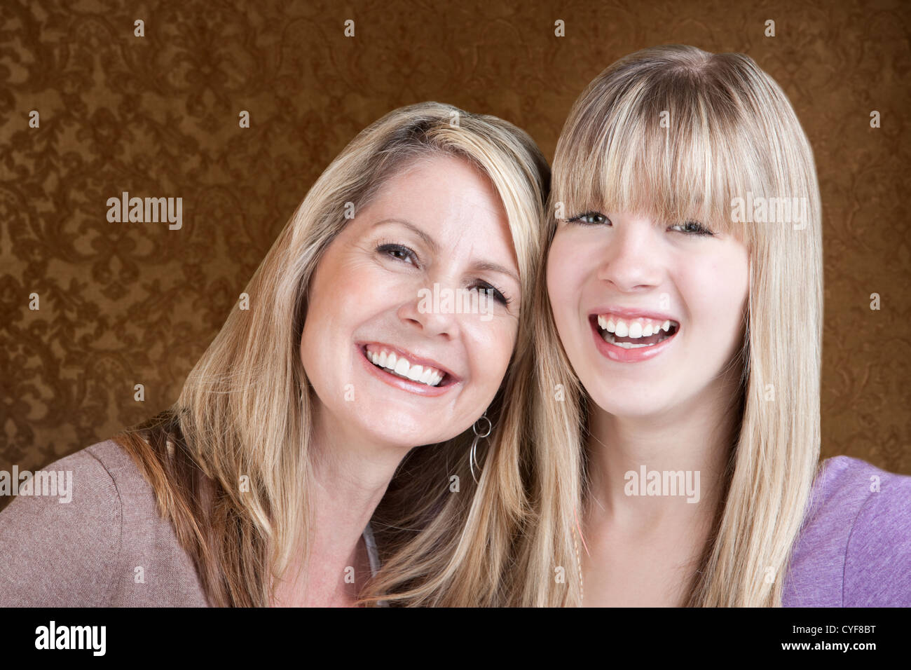 Happy Caucasian mom and daughter smile over green background Stock ...