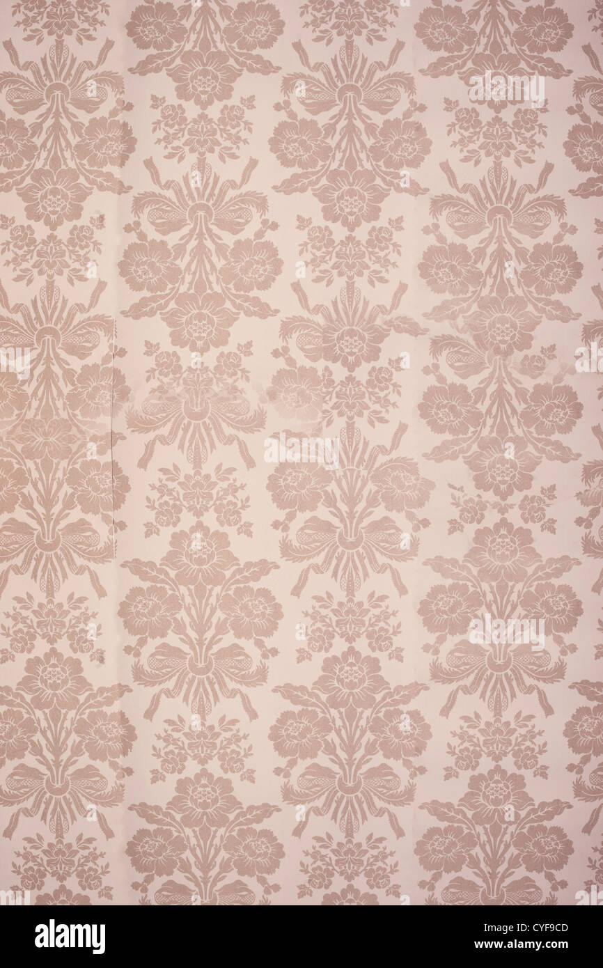 Vintage beige coloured floral wallpaper background with bouquets of flowers in rows Stock Photo