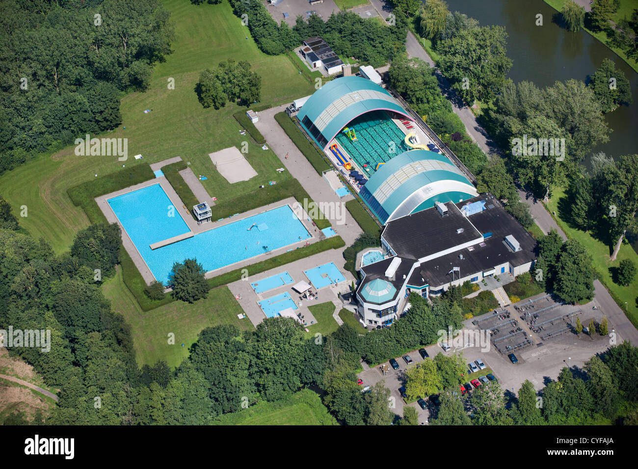 The Netherlands, Genemuiden, Outdoor and indoor municipal public swimming pool. Aerial. Stock Photo