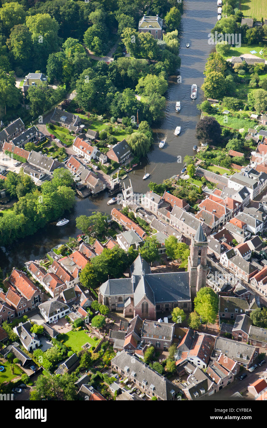 The Netherlands, Loenen aan de Vecht. River vecht. Boats passing drawbridge in center of village The Netherlands, Loenen aan de Vecht. River vecht. Boats passing drawbridge in center of village