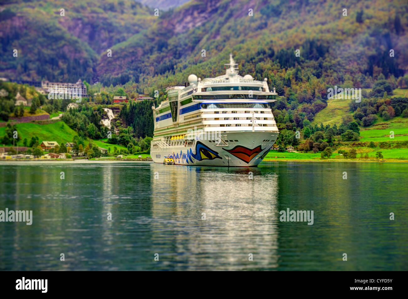 Cruise ship in Geiranger fjord HDR tilt shift Stock Photo