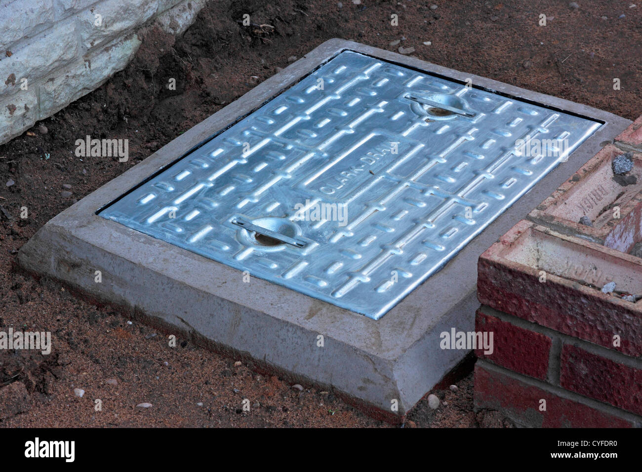 Newly Installed Domestic Drain Inspection Chamber Cover Stock Photo