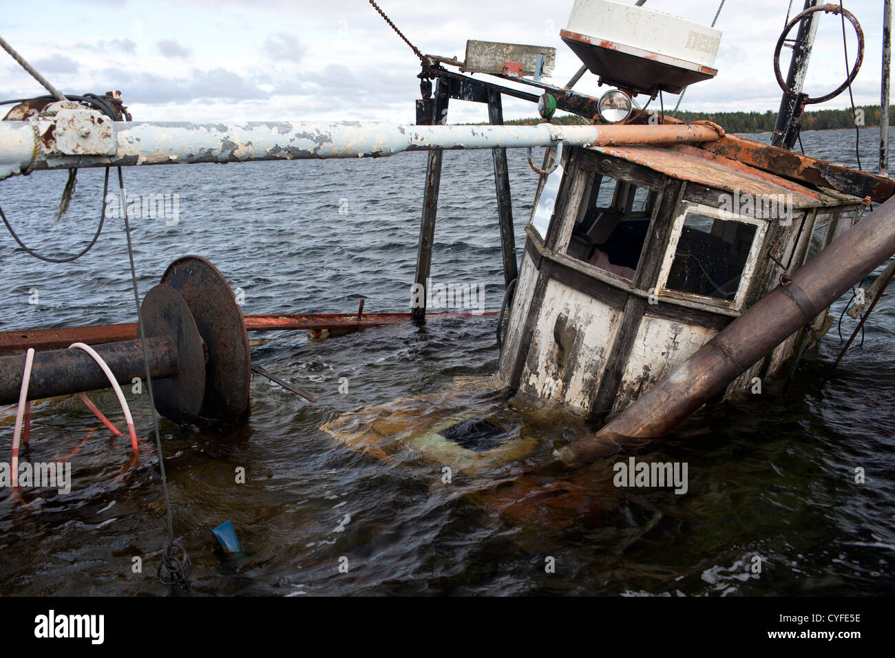 Sunken fishing boat in harbor Stock Photo