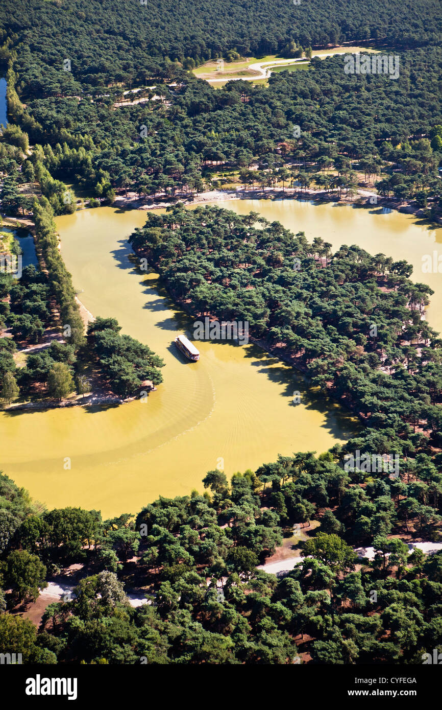 The Netherlands, Hilvarenbeek. Wildlife zoo called Safari park Beekse Bergen. Visitors exploring the park by boat. Aerial. Stock Photo