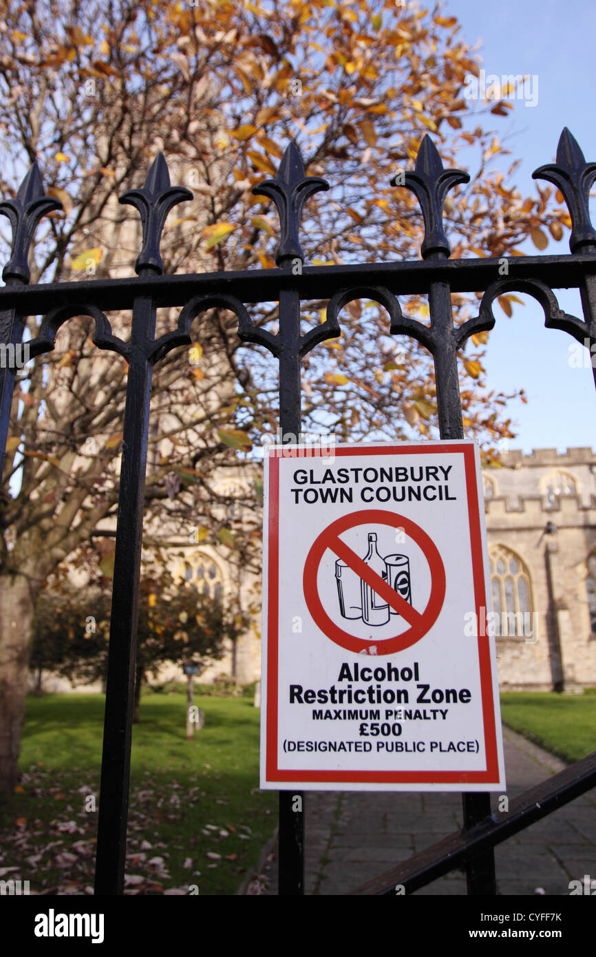 Alcohol Restriction Zone sign designated public place in Glastonbury town churchyard Stock Photo
