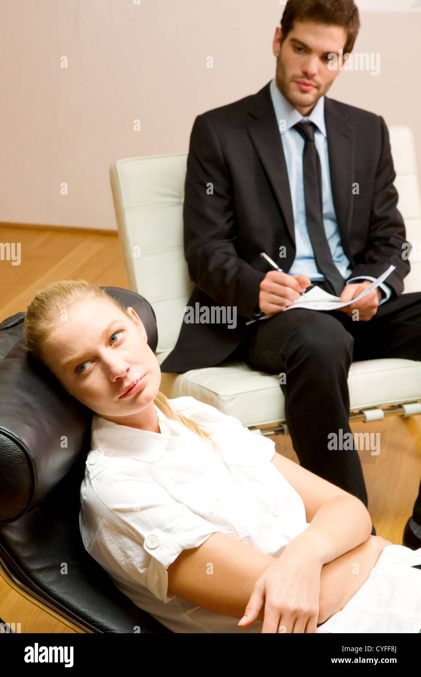 psychiatrist examining a female patient Stock Photo