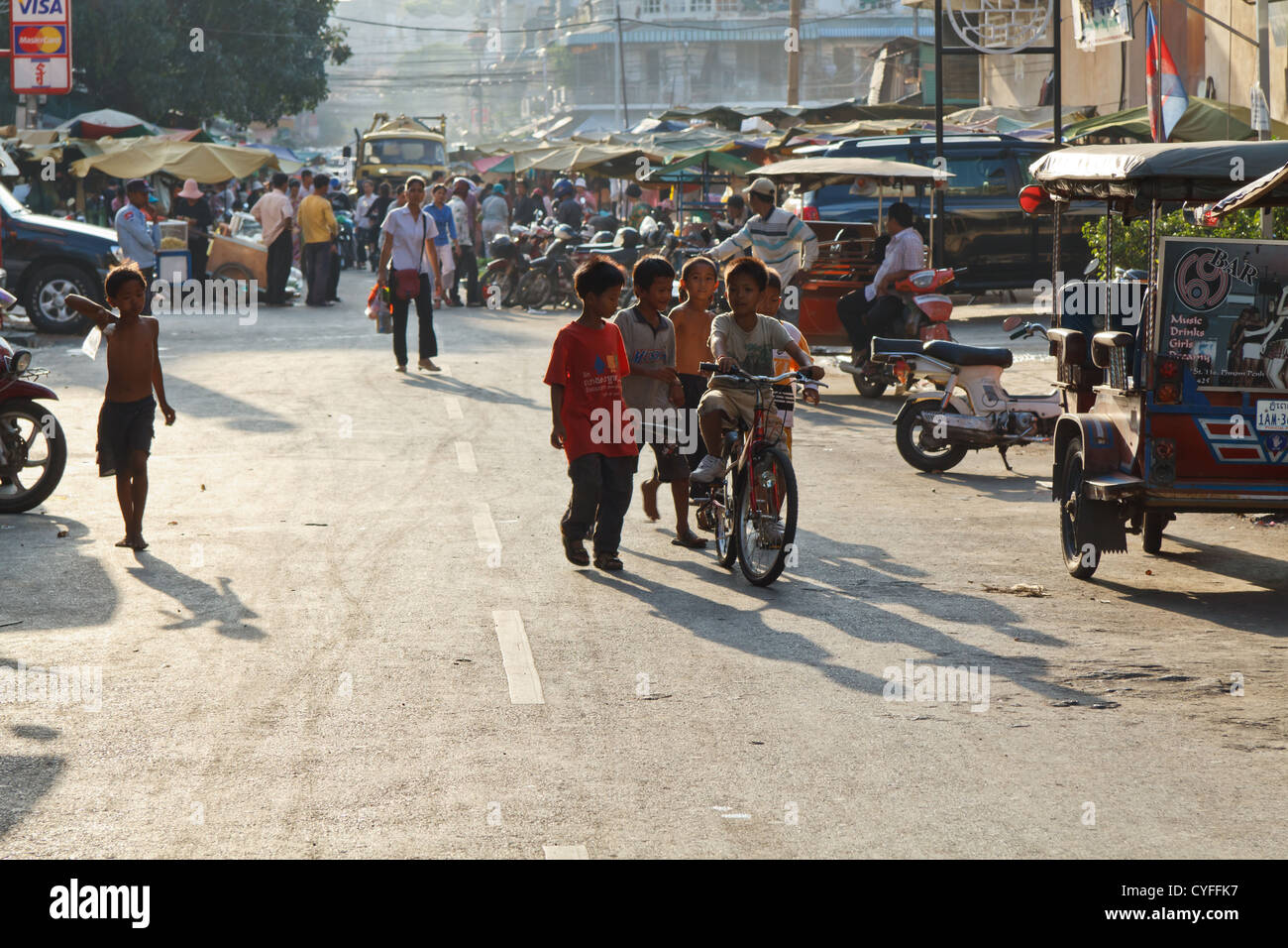 Street Kids playing in the Street in Phnom Penh, Cambodia Stock Photo ...
