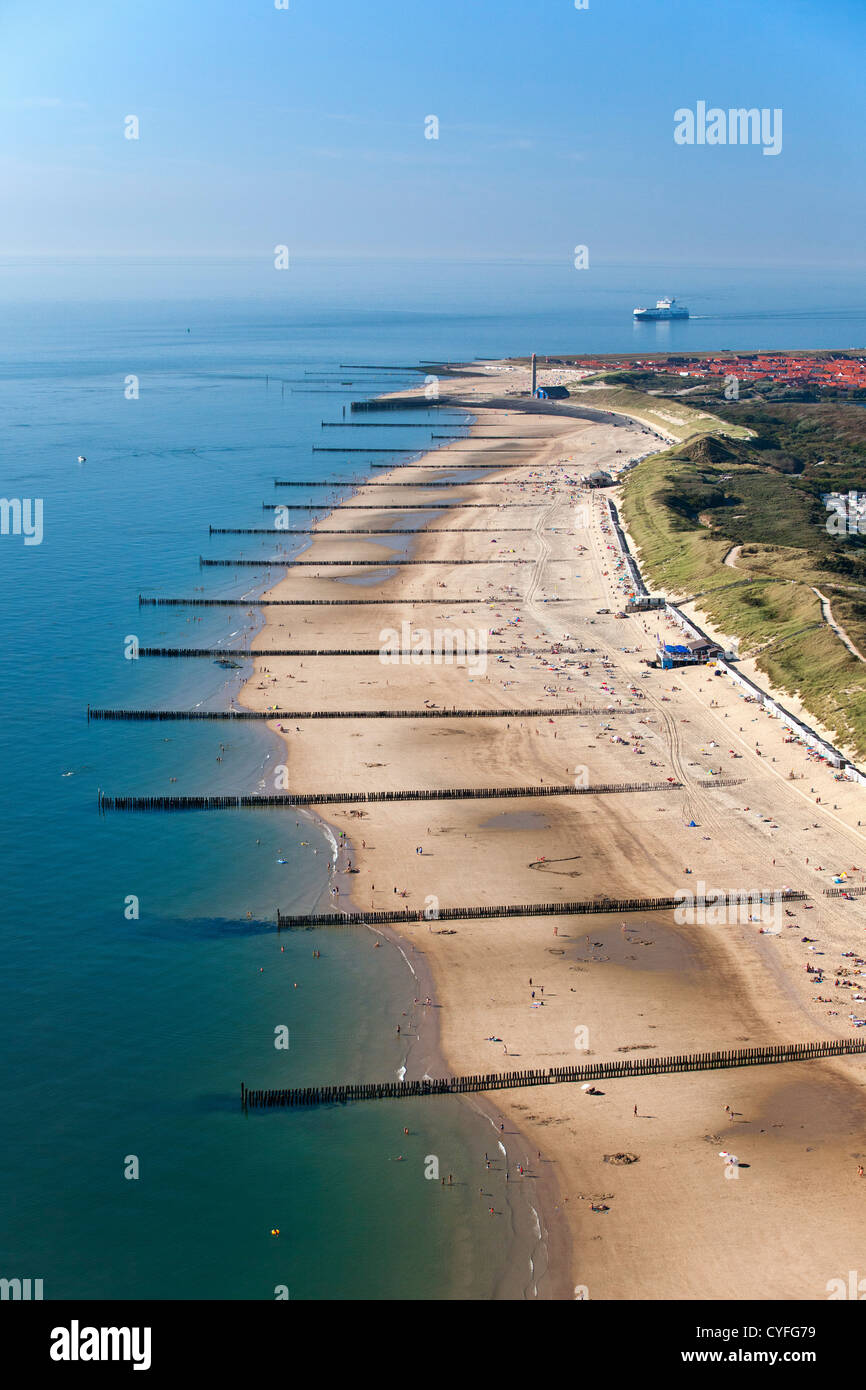 The Netherlands, Zoutelande. Beach near Westerschelde river. Cargo ship. Aerial. Stock Photo