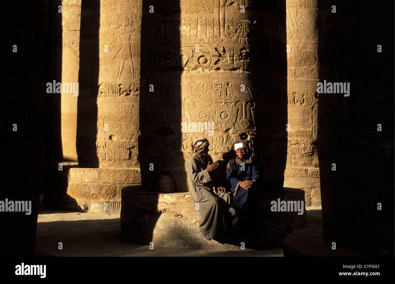 Egypt, Nile river, Luxor, East Bank, Karnak Temple. Hypostall Hall. 'Forest' of giant papyrus-shaped columns. Guards Stock Photo