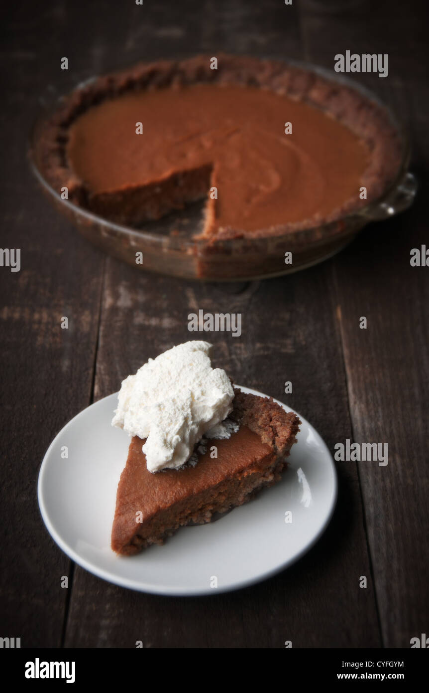 Slice of pumpkin pie with whipped cream Stock Photo