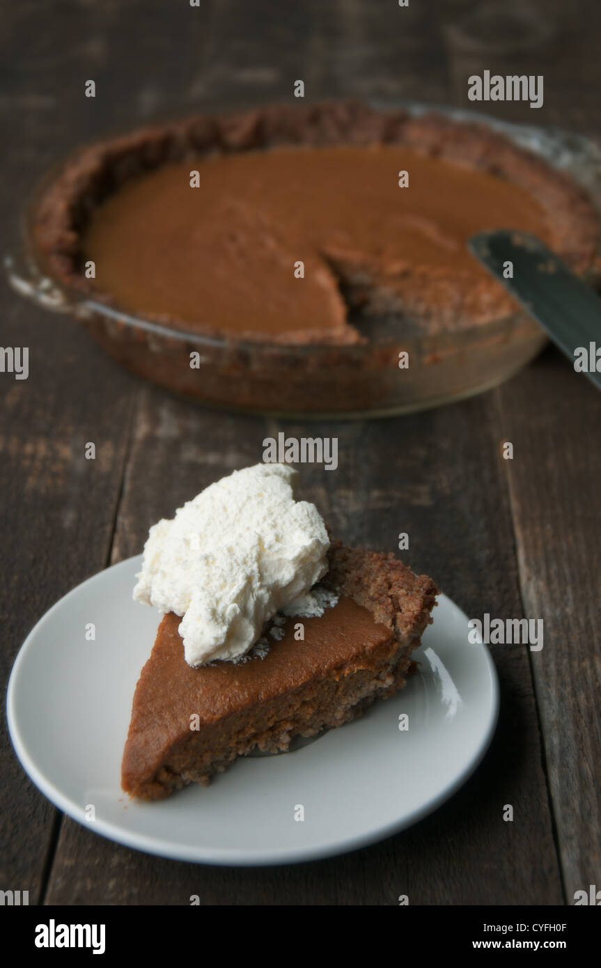 Homemade pie with nut crust and whipped cream Stock Photo