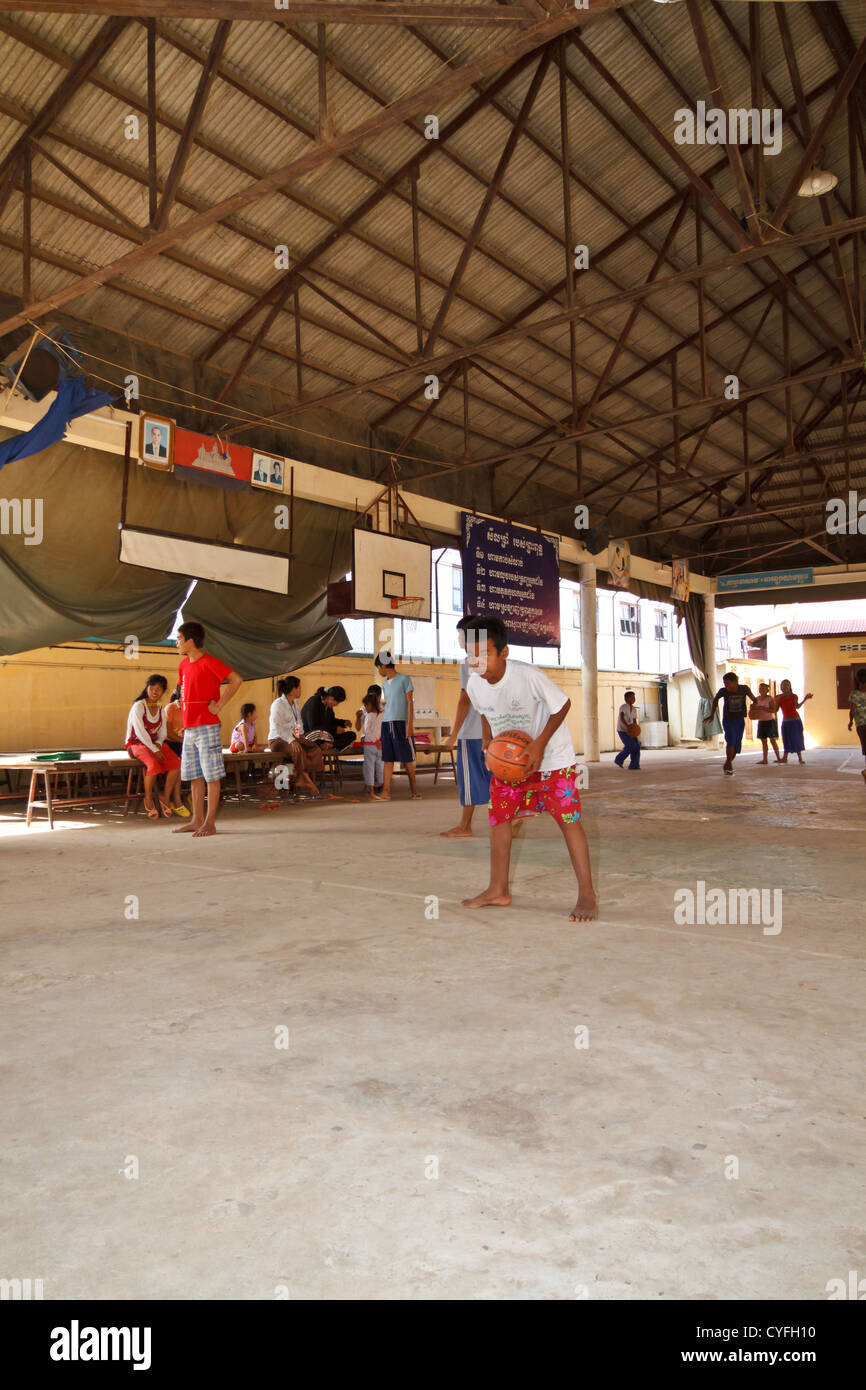 Children playing Basketball in a Sports Hall of the NGO Pour un Sourir
