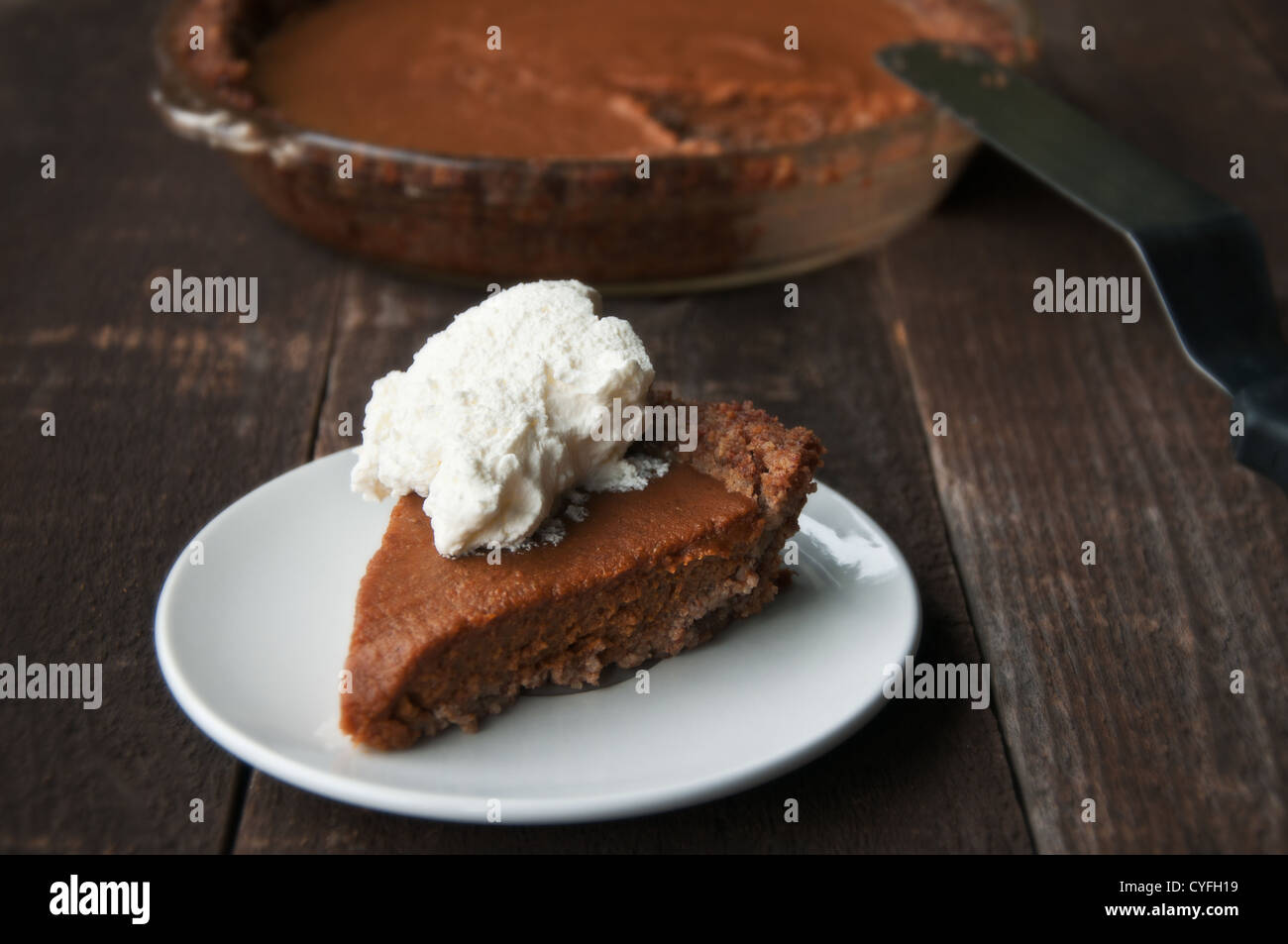 Slice of pumpkin pie with whipped cream Stock Photo