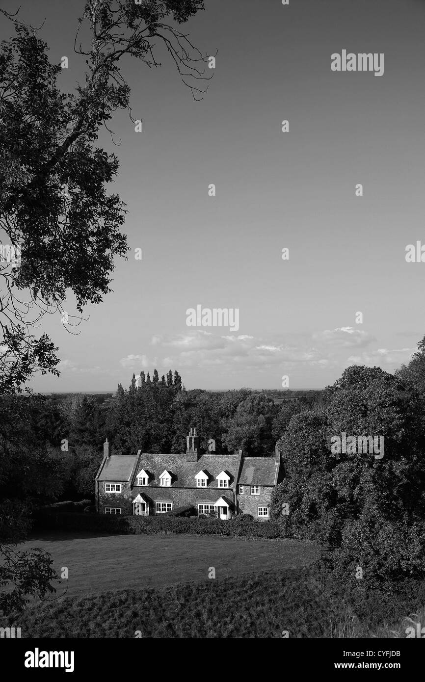 Black and White image Summertime view over cottages at Castle Rising village, North Norfolk, England, UK Stock Photo