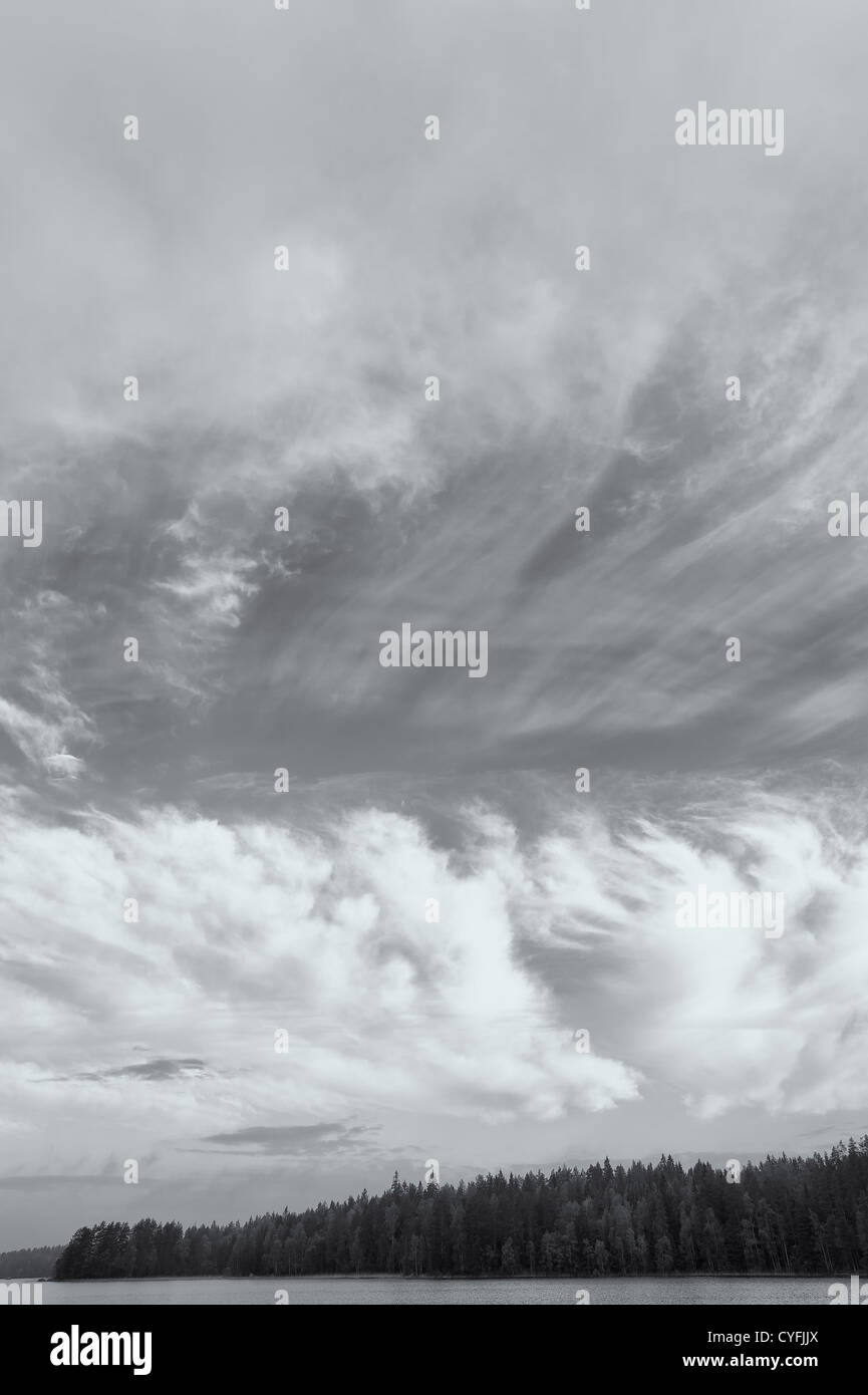 Dramatic clouds on the sky, colored black and white image. Stock Photo