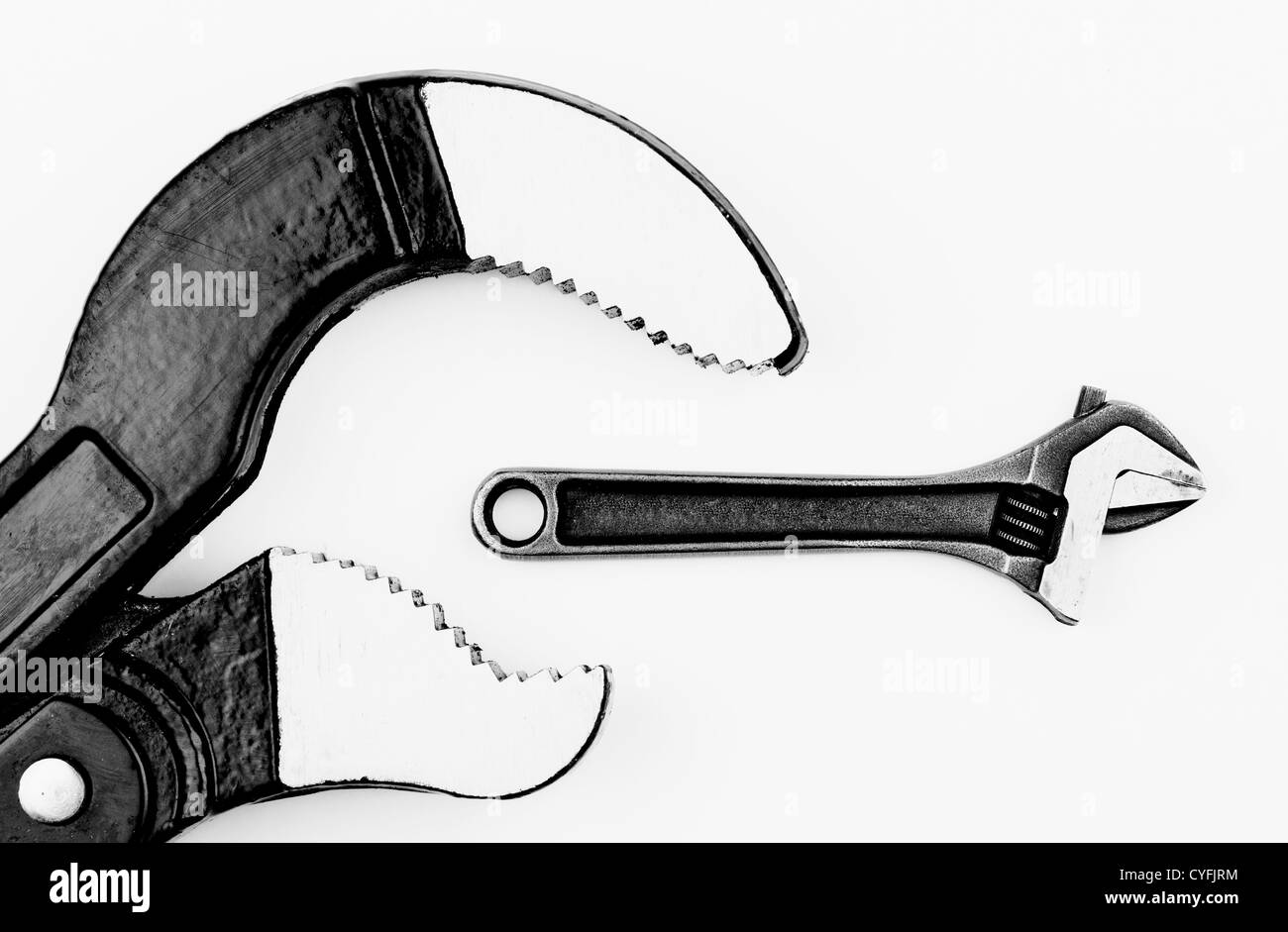 Law of nature, eat or be eaten. Two tools, black and white photo, white background Stock Photo