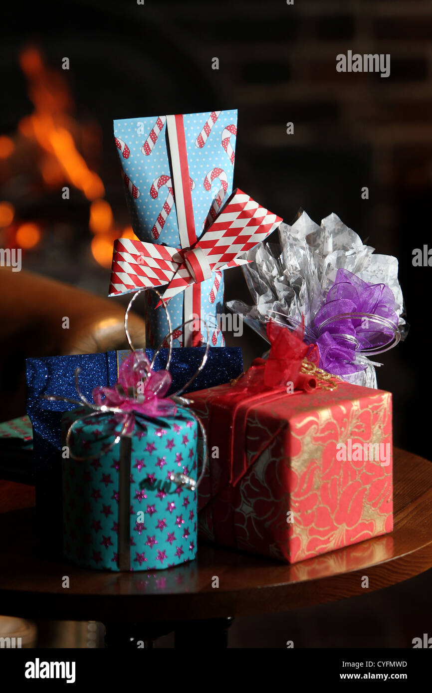 Presents in front of the fireplace in The Lamb pub in Angmering, Sussex, UK. Stock Photo