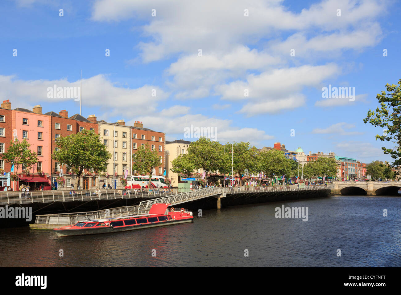 View across the River Liffey to Batchelor's Walk with cruise boat moored by jetty from Temple Bar, Dublin, Ireland, Eire Stock Photo
