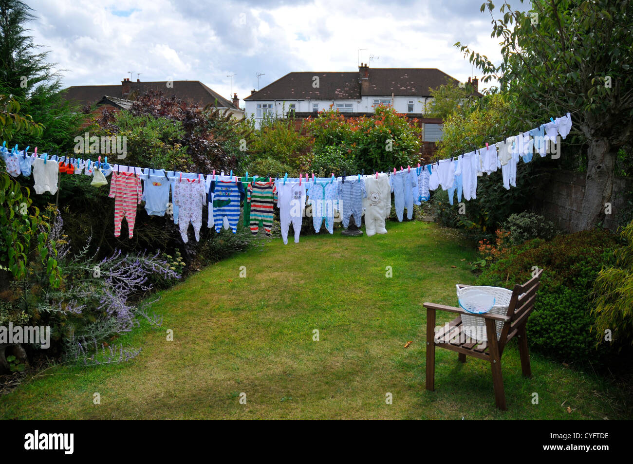 A washing-line full of baby clothes ready for a new arrival. Stock Photo