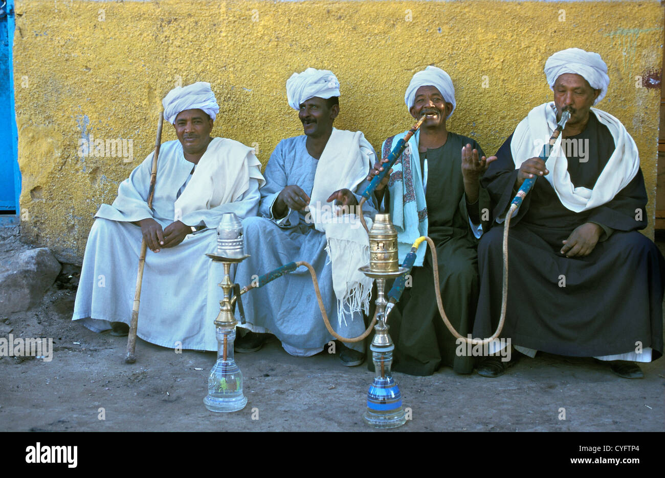 Egypt, Aswan. Men relaxing, smoking water pipe Stock Photo Alamy