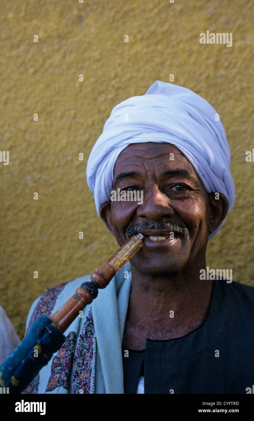 Egypt, Aswan, Nile valley, Portrait of Nubian man smoking water pipe Stock Photo Alamy