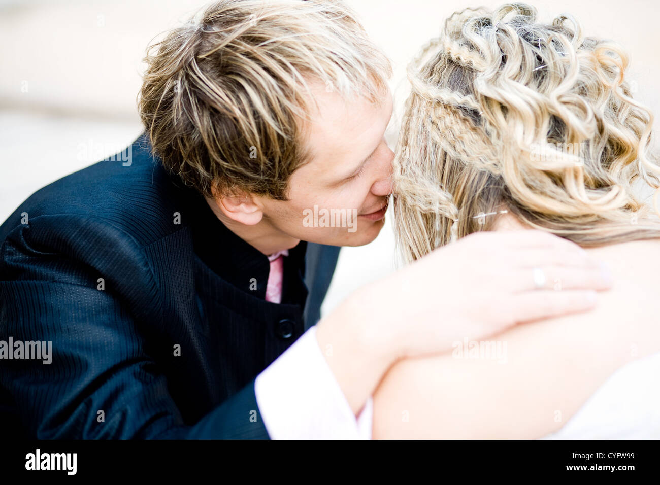 Kissing bride and groom in their wedding day Stock Photo - Alamy