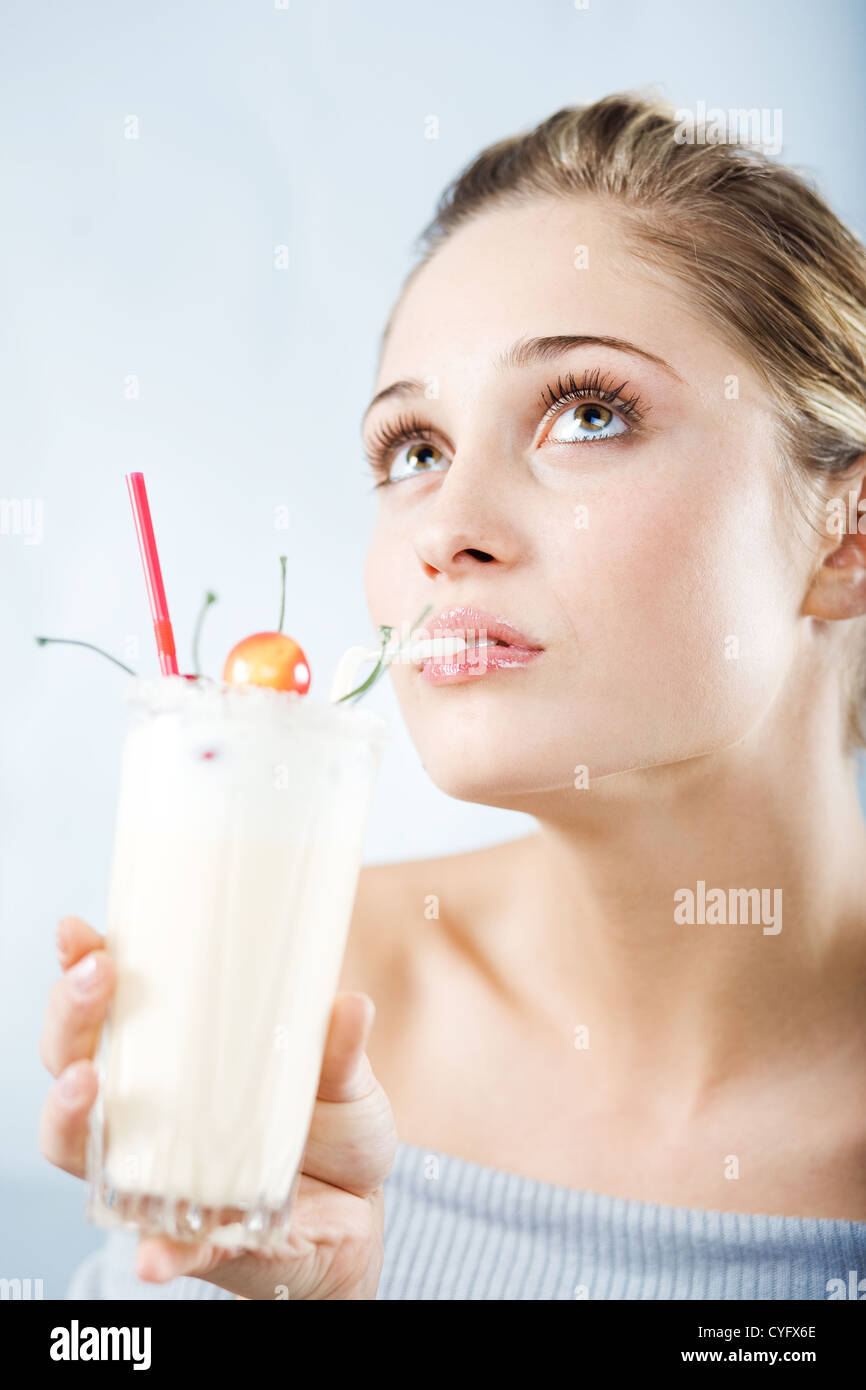 Beautiful woman drinking milk cocktail Stock Photo Alamy