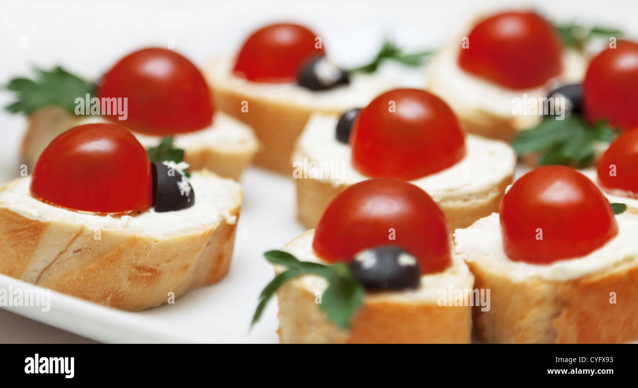 Delicious appetizer with bread and tomatoes Stock Photo