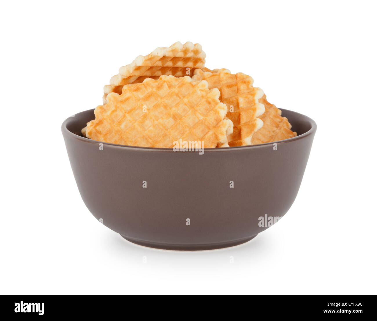 Big bowl of crunchy waffles isolated over white background Stock Photo