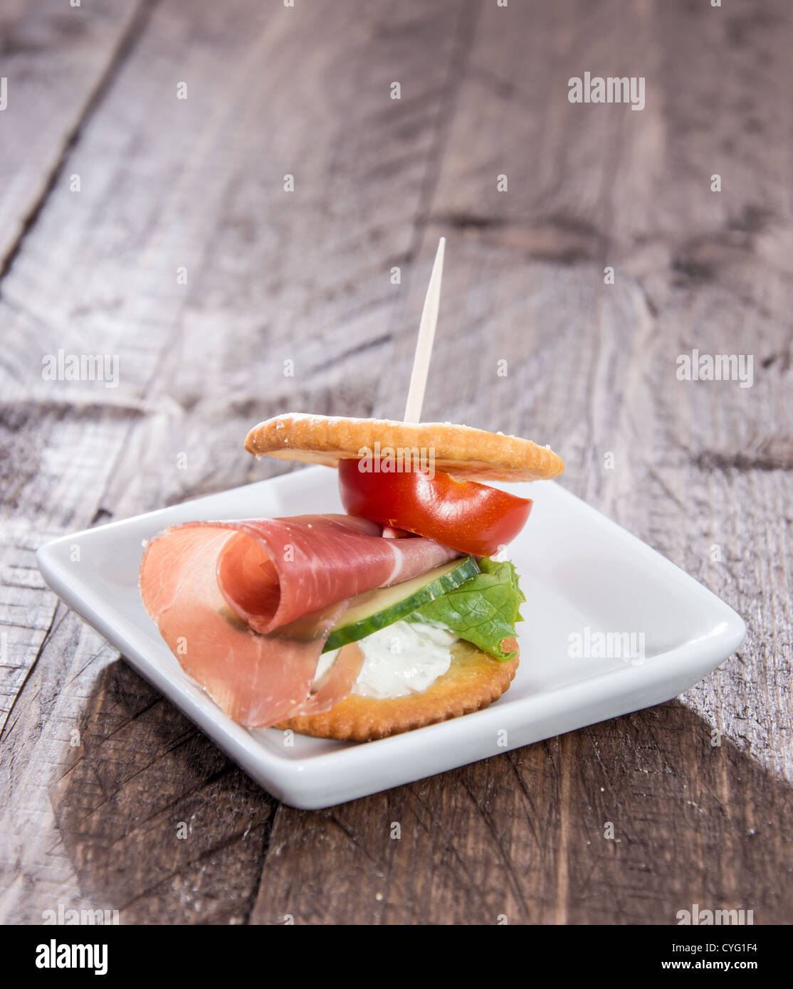 Crackers with Ham, Cream Cheese and Vegetables Stock Photo Alamy