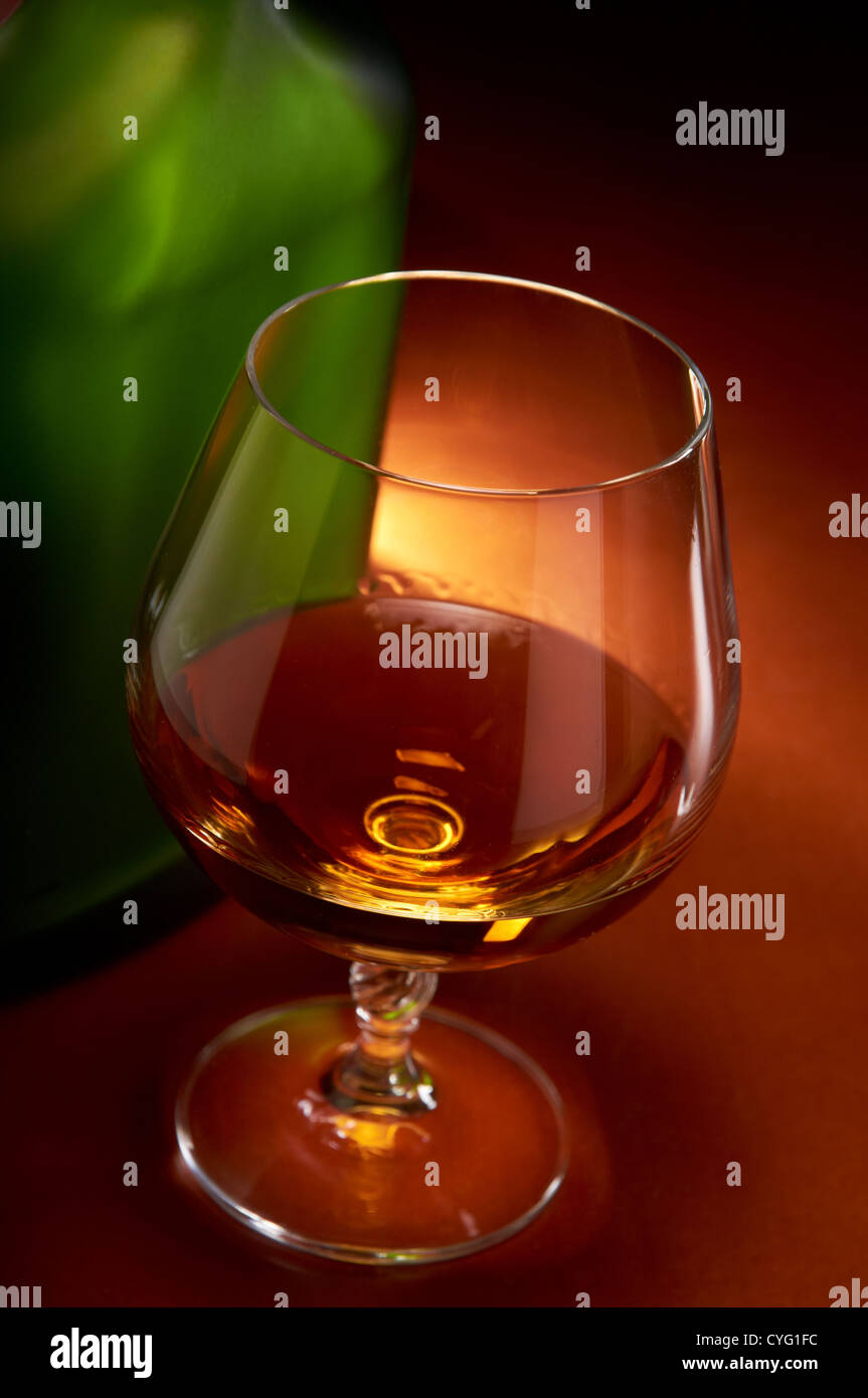 Cognac glass and bottle Stock Photo Alamy