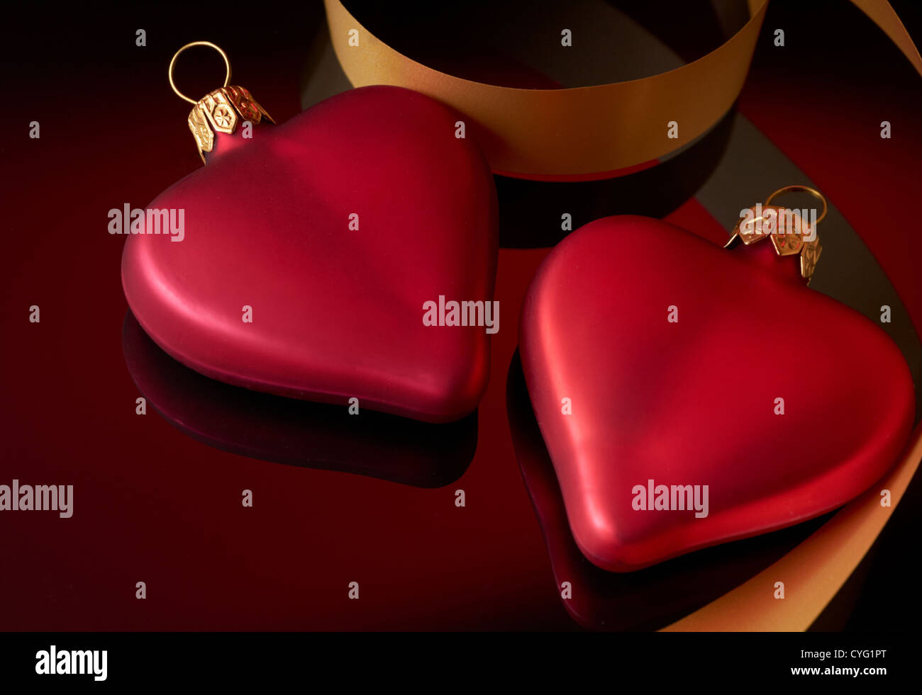 Two hearts with ribbon Stock Photo - Alamy