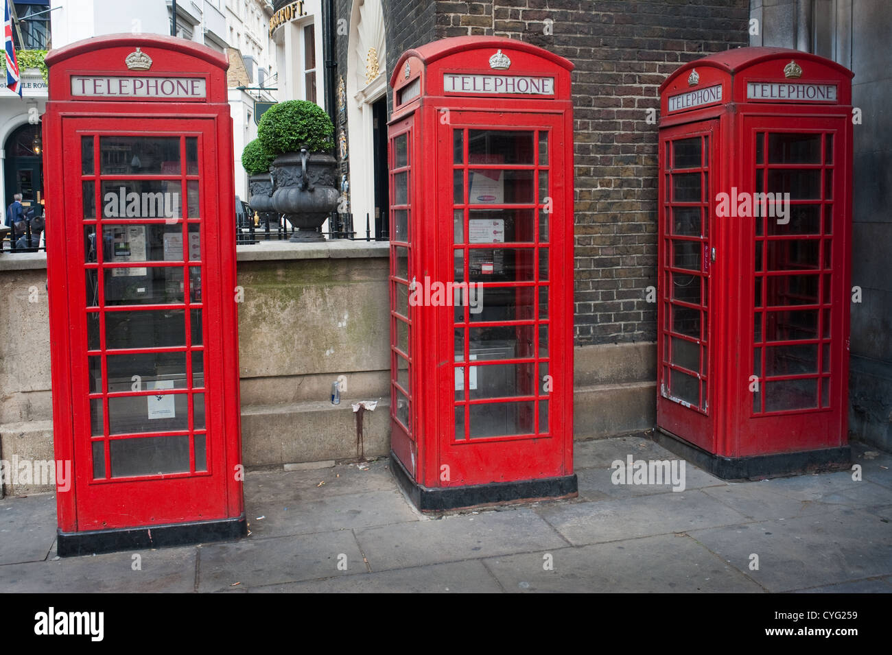 Three Phone boxes in a London street Stock Photo