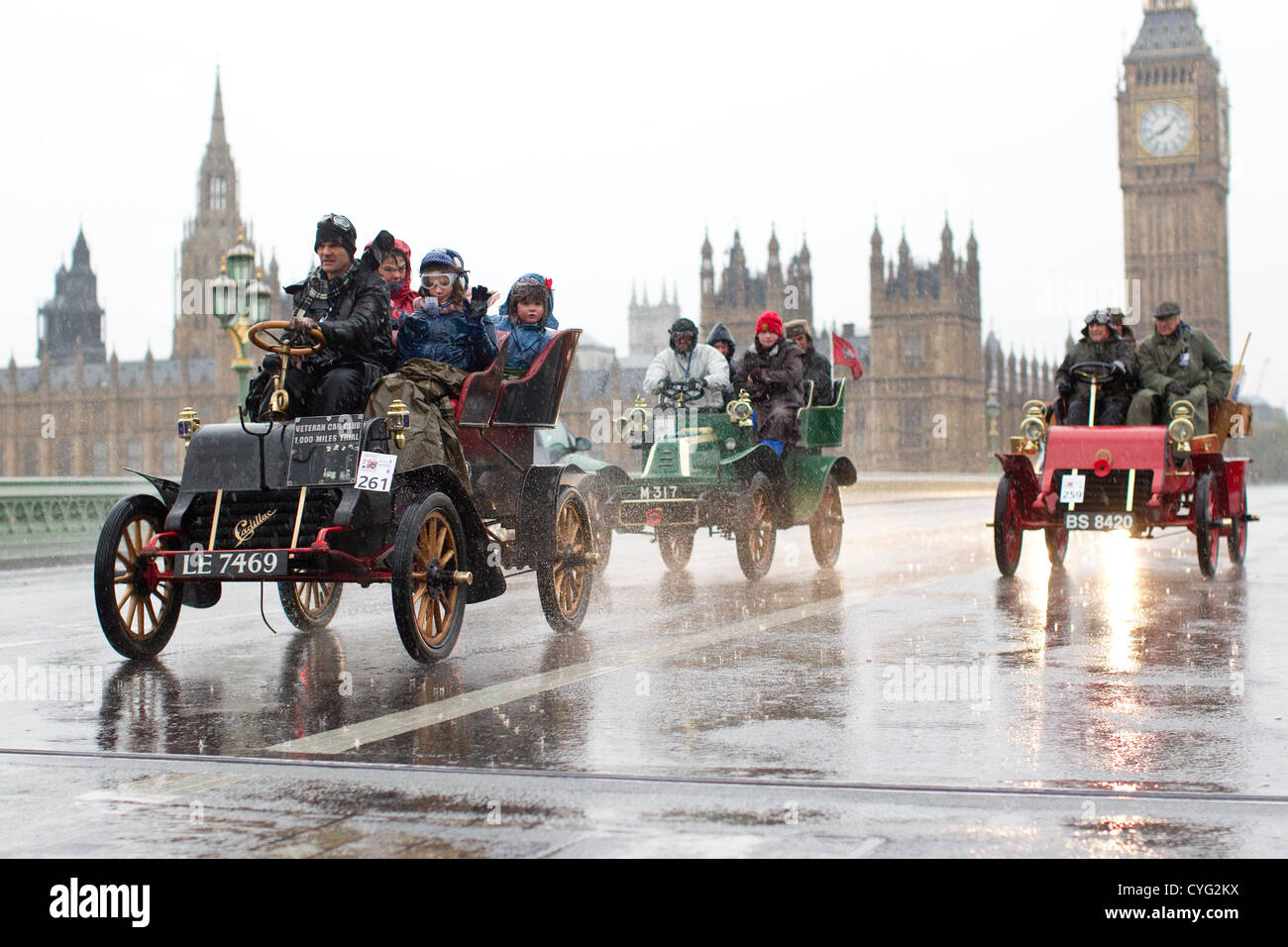 Royal Automobile Club's annual Veteran Car Run London to Brighton. 04.11.2012 Picture shows No.261 a 1903 Cadillac driven in wet conditions by Martin Ashby crossing Westminster Bridge, one of many classic vehicles taking part in this years London to Brighton Veteran Car Run 2012 starting at Hyde Park in Central London and finishing at the seafront on the Sussex resort of Brighton. Stock Photo