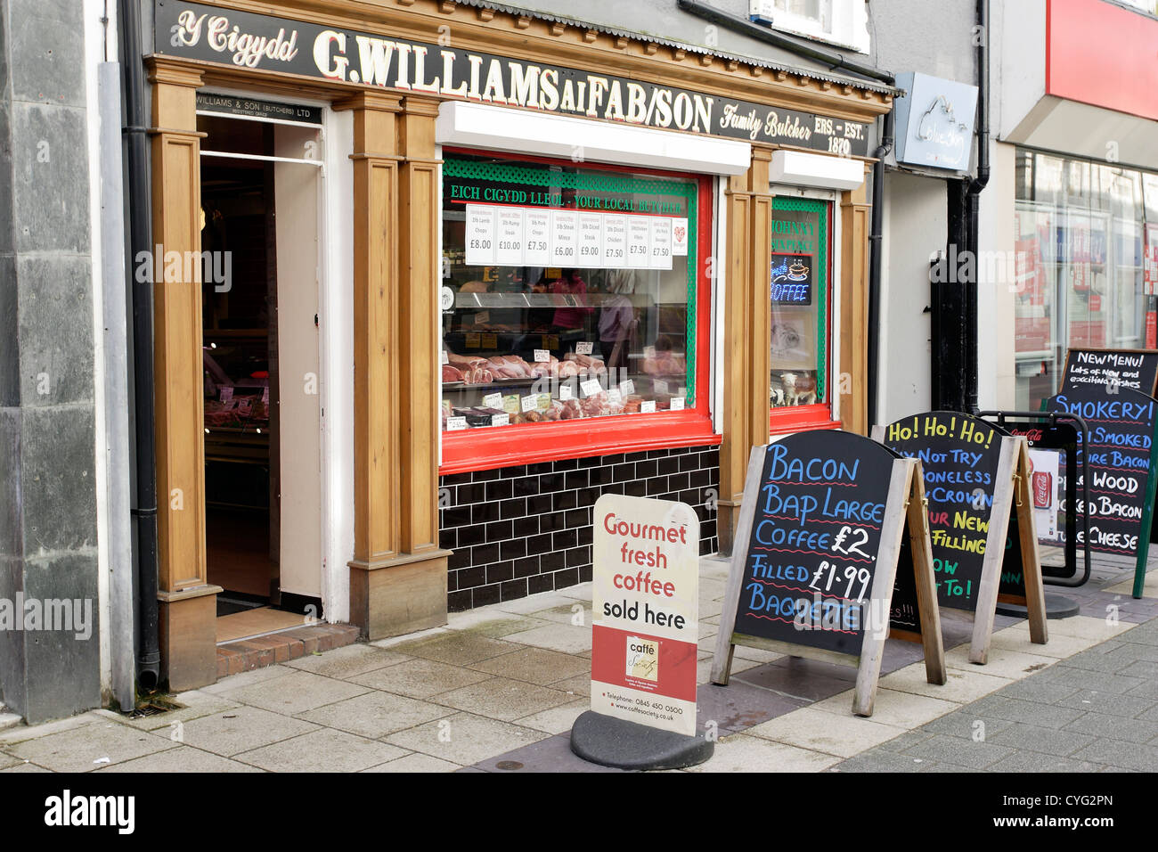 A traditional family butchers shop in Bangor high street, North Wales. Stock Photo