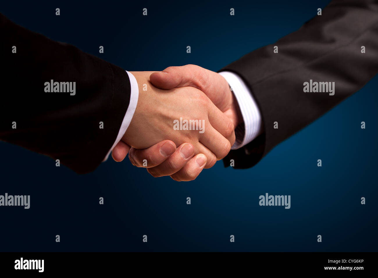 Closeup of a business hand shake between two colleagues Stock Photo