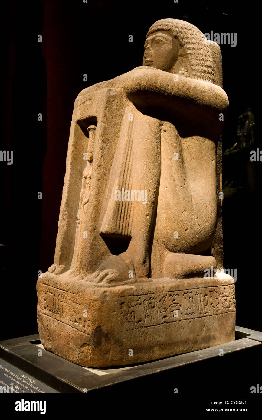 Turin Egyptian Museum / sandstone statue of the priest 'en' [dynasty XX 1100BC] Stock Photo