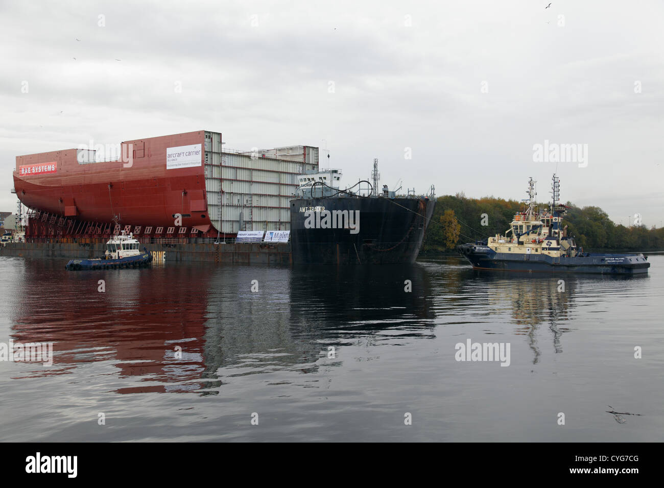 BAE Systems, Govan, Glasgow, Scotland, UK, Sunday, 4th November, 2012. A completed section of hull for the Royal Navy Aircraft Carrier HMS Queen Elizabeth departs on the barge AMT Trader, sailing on the River Clyde Stock Photo