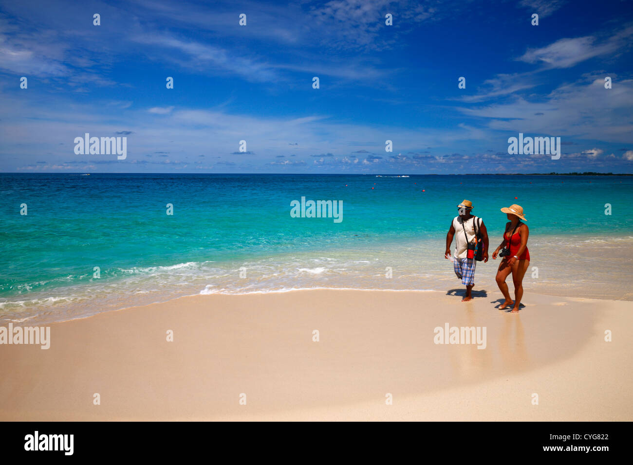 Man walking on caribbean beach hi-res stock photography and images - Alamy