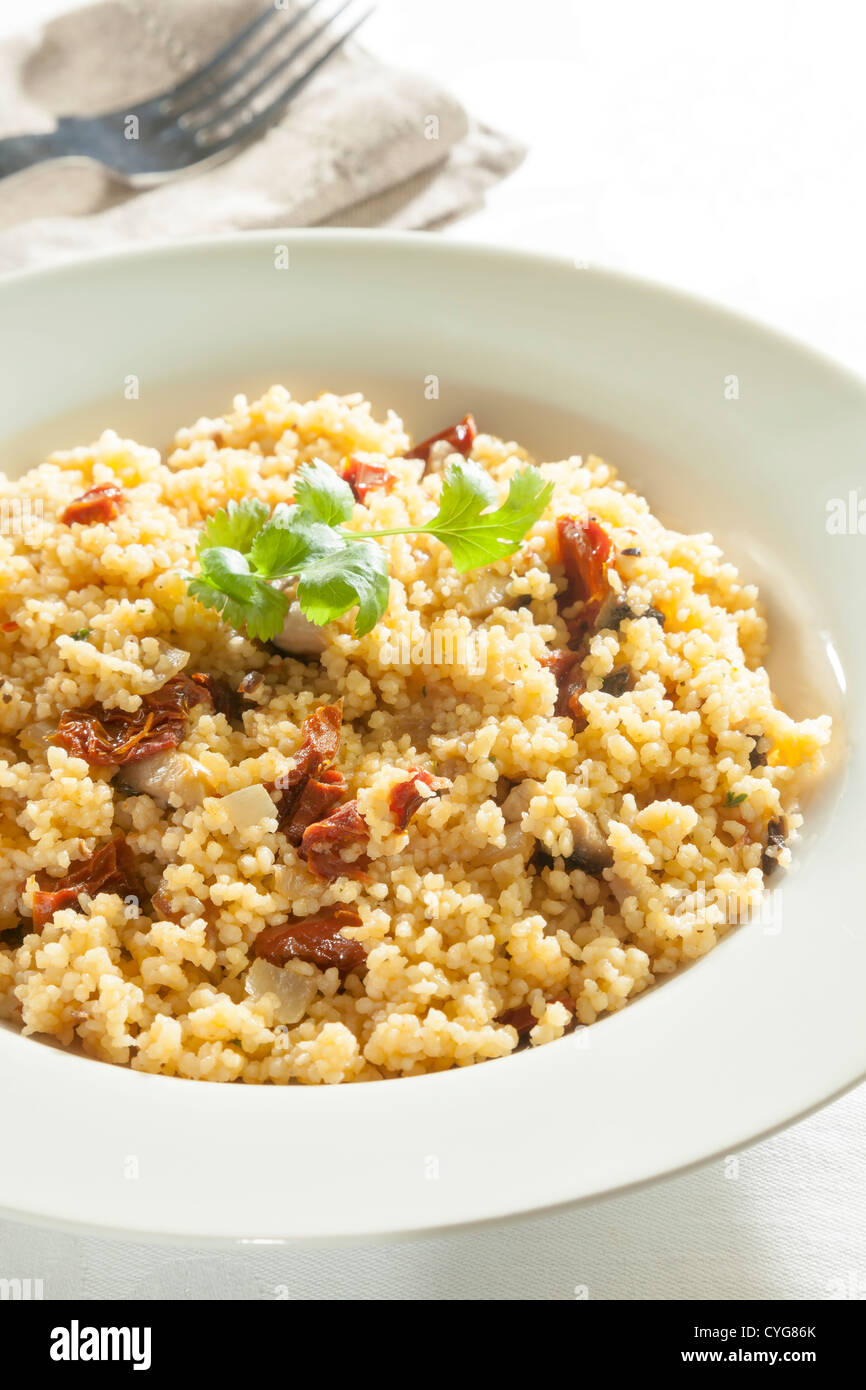 cous cous with sundried tomatoes and mushrooms Stock Photo