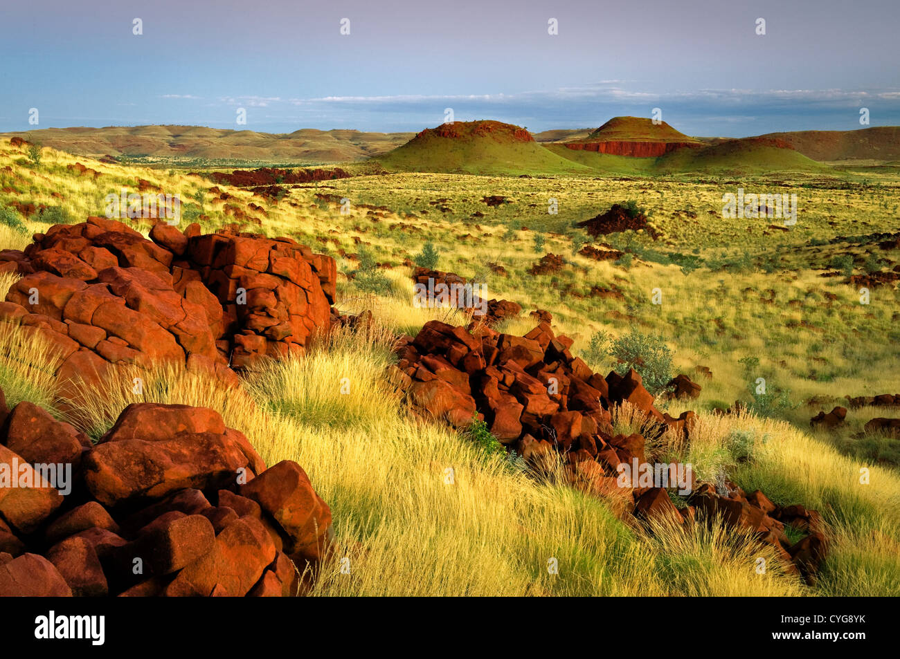 Red rocks and Spinifex hills in Chichester Range. Stock Photo