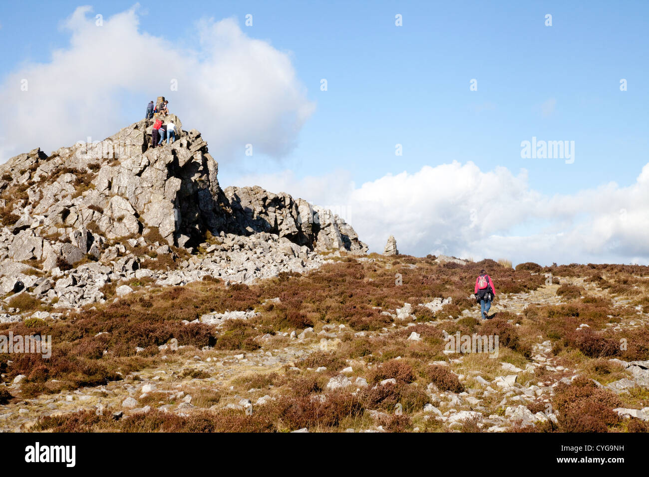 Walkers at Manstone Rock, the high point on the Stiperstones National Reserve Shropshire UK Stock Photo