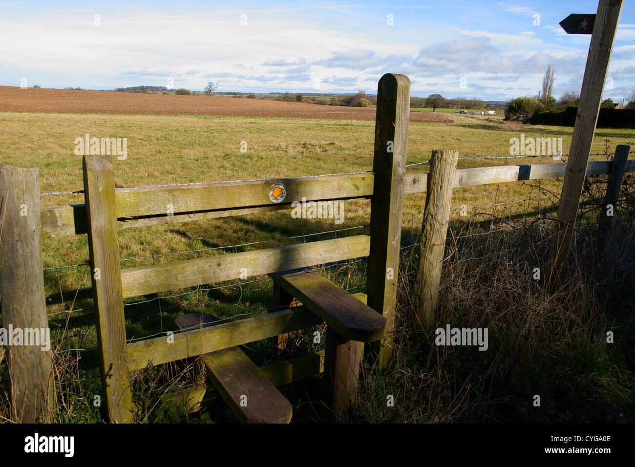 Country stile with a right of way sign outside Hodnet in Shropshire England Stock Photo