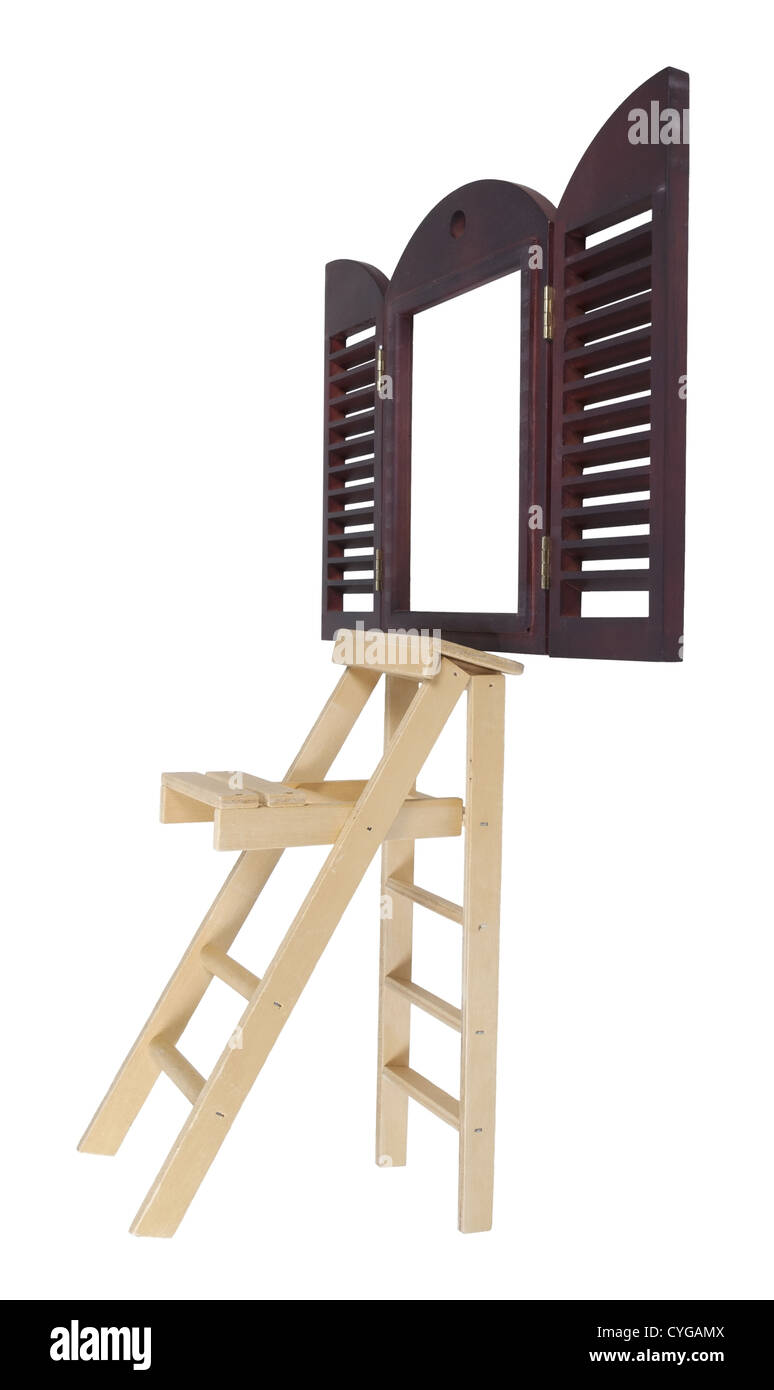 Step Ladder used for reaching higher items next to a shuddered window - path included Stock Photo