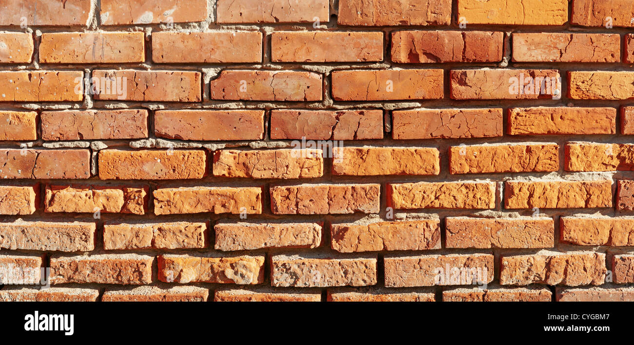 Aged brick construction wall Stock Photo - Alamy