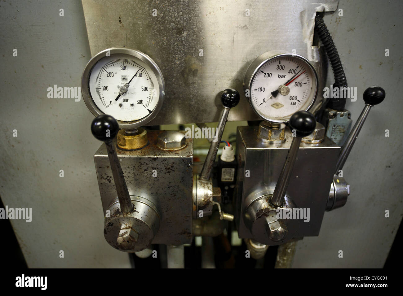 Gauges measuring pressure at an olificio pressing olives into oil in the Abruzzo region of Italy. Stock Photo
