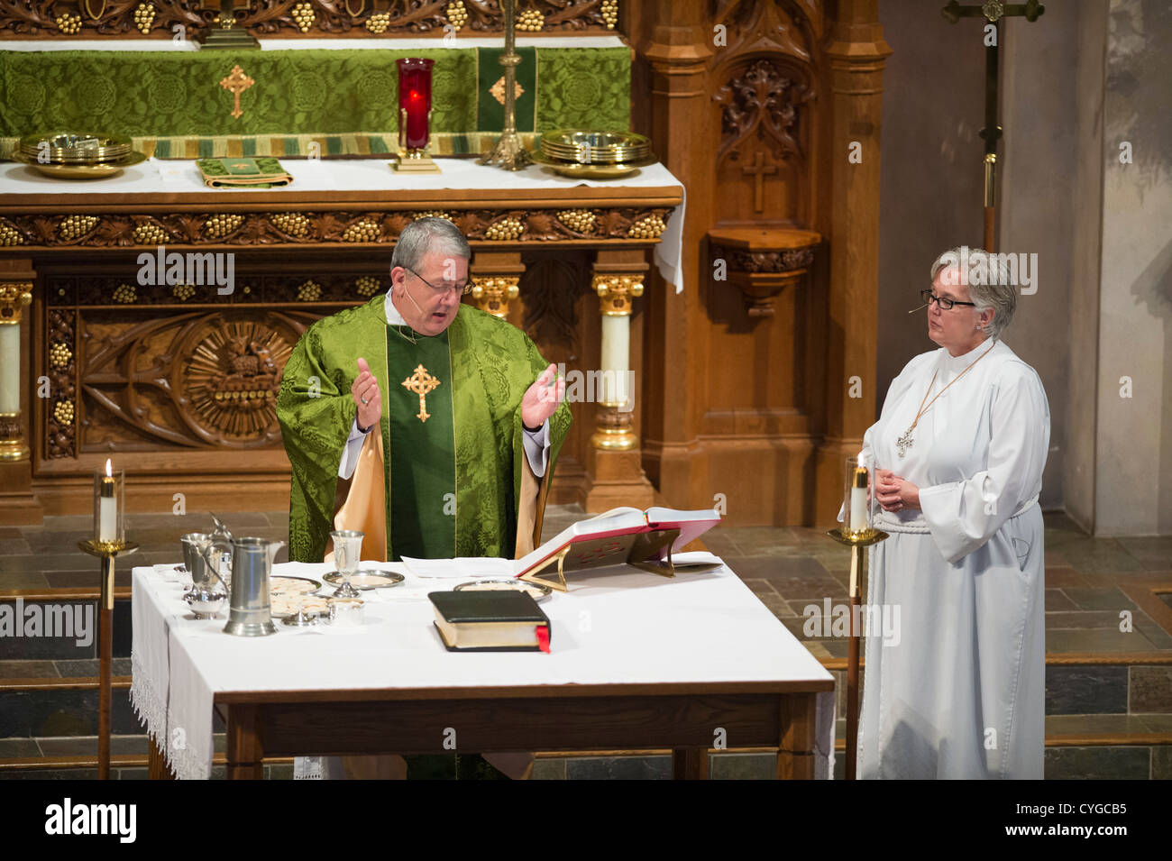 Lutheran minister reads blessing from Bible during service at St