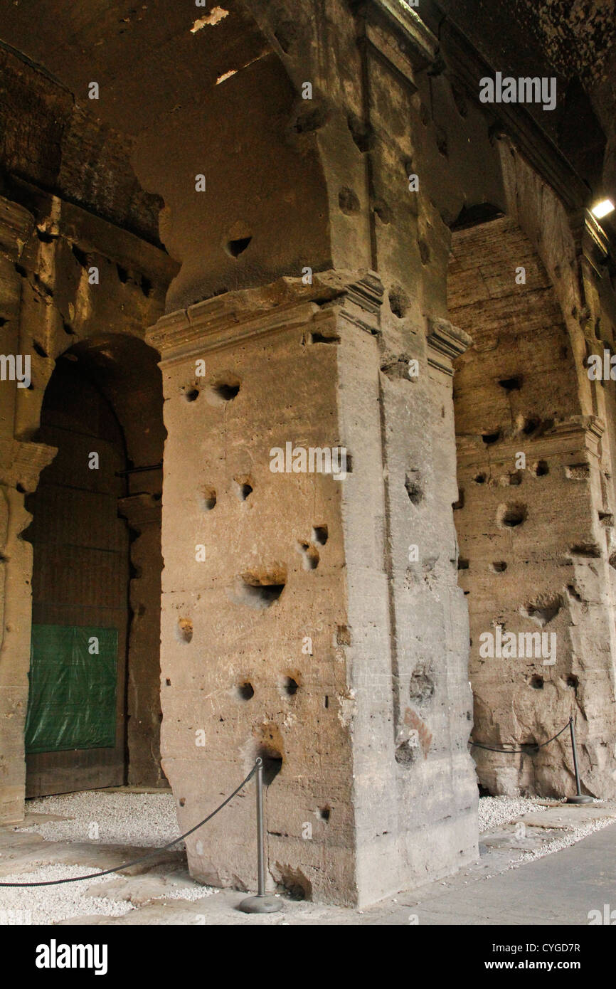 Interior columns in the Colosseum display marks left behind after the