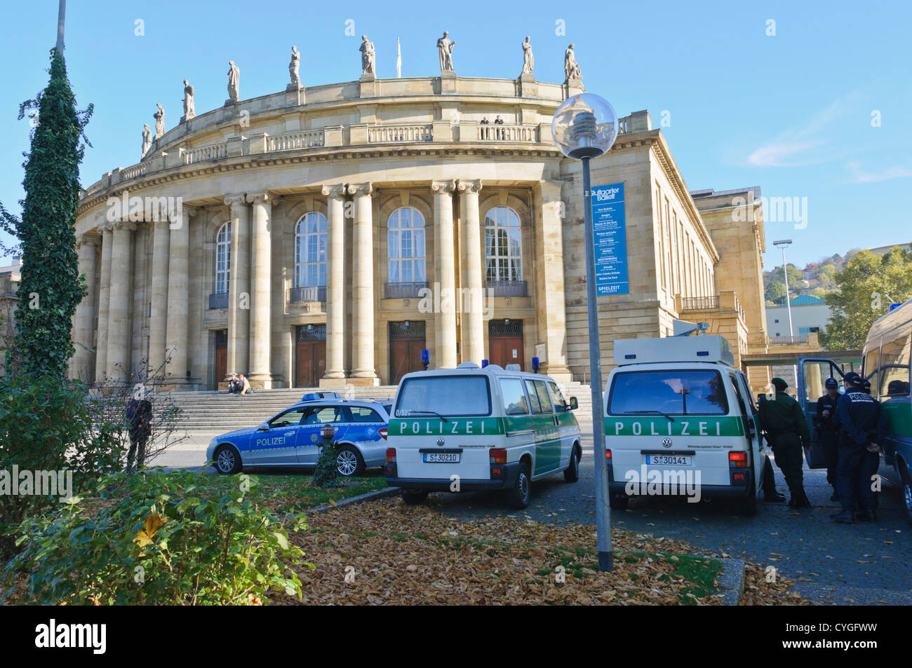 German police patrol vehicles and policemen in front of the State Theatre Stuttgart Baden-Wuerttemberg South Germany Stock Photo